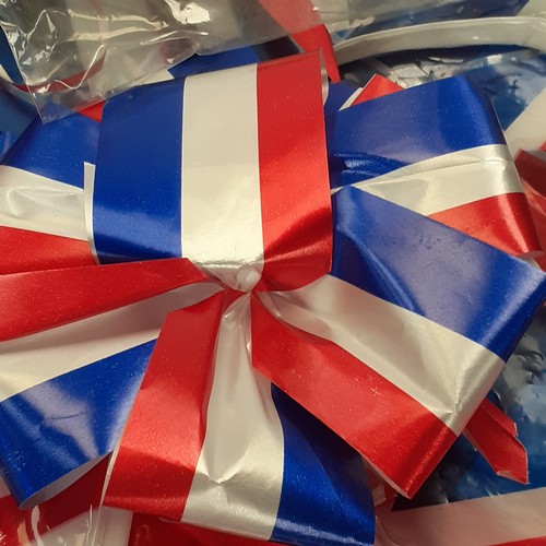 2 - A quantity of union flags, and St George’s flags. Four lots of bunting plus some individual.