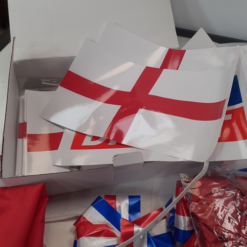 2 - A quantity of union flags, and St George’s flags. Four lots of bunting plus some individual.