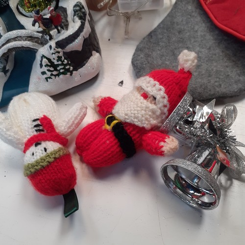 4 - A quantity of Christmas decorations, including stockings, Santa ornaments, teddy bears and more