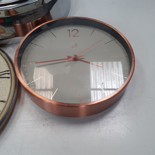 11 - Three kitchen wall clocks each battery operated and require the batteries. Overall nice condition