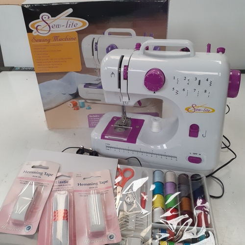 15 - Sew lite sewing machine. With accessories, pedal etc. Hardly used, very good condition. Tested and w... 