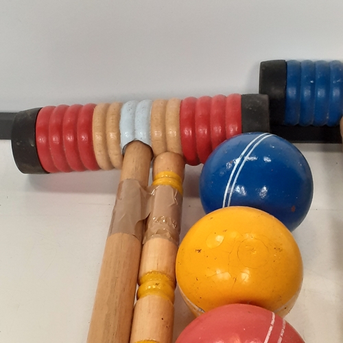 18 - Croquet set. Set of sticks, balls, pegs etc. Played with but good condition