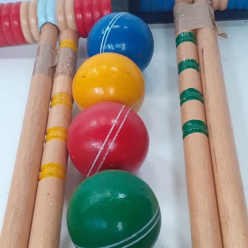 18 - Croquet set. Set of sticks, balls, pegs etc. Played with but good condition