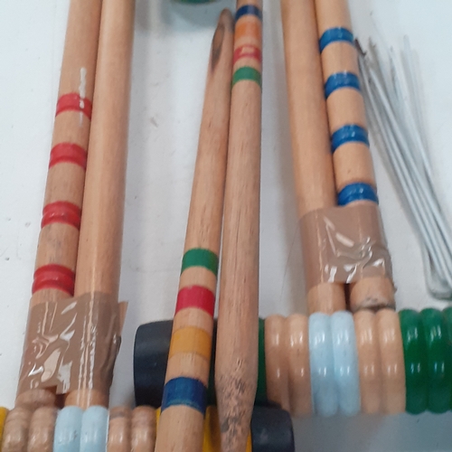 18 - Croquet set. Set of sticks, balls, pegs etc. Played with but good condition