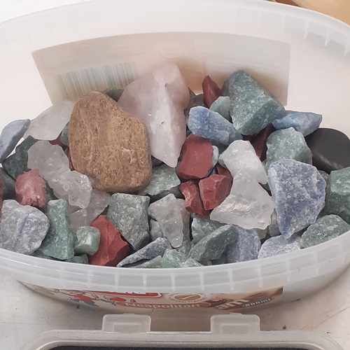 21 - A quantity of rock polishing/stone tumbling grit and rocks.