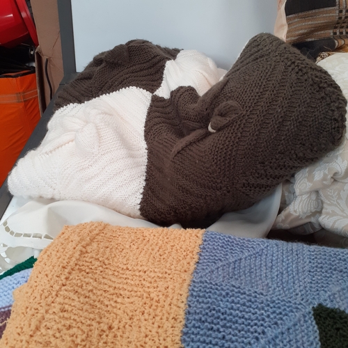 30 - 5 knitted blankets, 2 pairs of curtains, 4 cushions and a rug. Some pulls in the wool and z little s... 