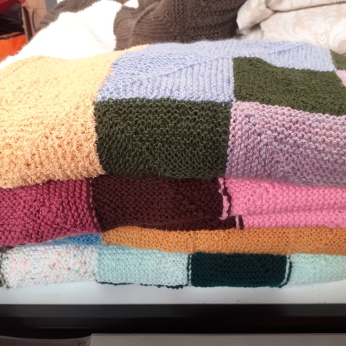 30 - 5 knitted blankets, 2 pairs of curtains, 4 cushions and a rug. Some pulls in the wool and z little s... 