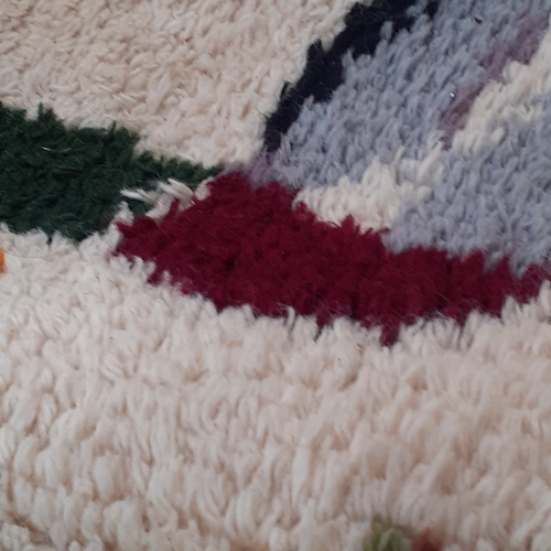 30 - 5 knitted blankets, 2 pairs of curtains, 4 cushions and a rug. Some pulls in the wool and z little s... 