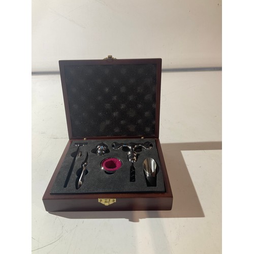 150 - boxed wine connisuers  set including cork screw wine stoppers etc