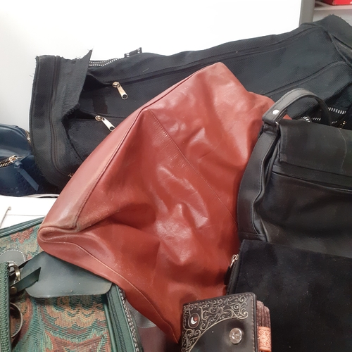 33 - Large quantity of bags, handbags,  holdalls, purses, wallets and more. All useable with zips etc wor... 