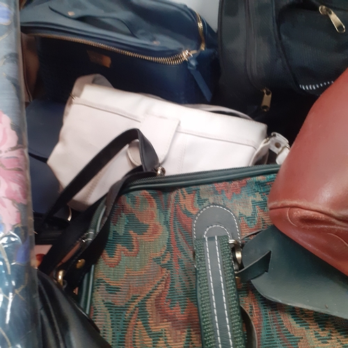 33 - Large quantity of bags, handbags,  holdalls, purses, wallets and more. All useable with zips etc wor... 