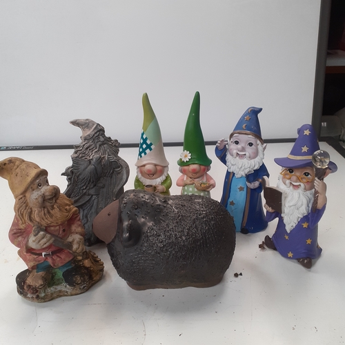 8 - Garden gnomes, wizard and a sheep. Most are stone, and a couple of moulded material. Some general we... 