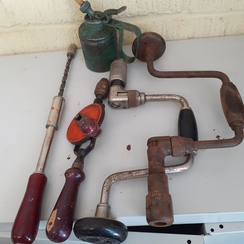 13 - A selection of hand drills and a vintage Wesco oil can. Expected wear for age but mostly good usable... 