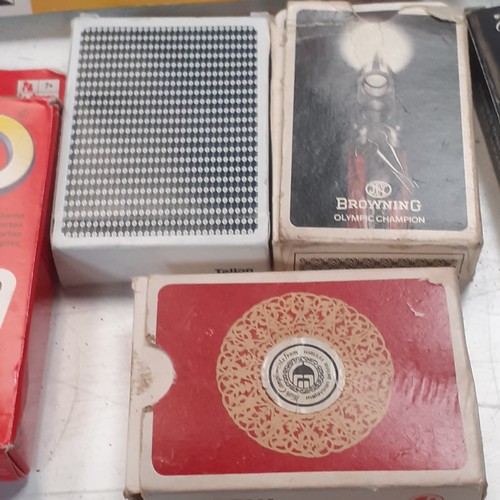 10 - A quantity of playing cards and related items. Includes Uno, giant cards, a compendium if card games... 