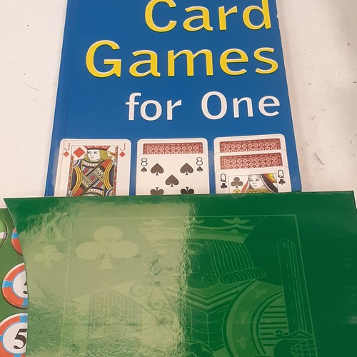 10 - A quantity of playing cards and related items. Includes Uno, giant cards, a compendium if card games... 