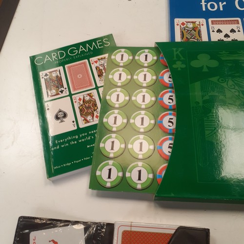 10 - A quantity of playing cards and related items. Includes Uno, giant cards, a compendium if card games... 