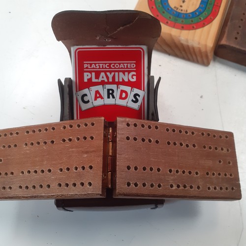 9 - 5 very  attractive cribbage boards with a sixth small cased one and 3 decks of playing cards. Some g... 