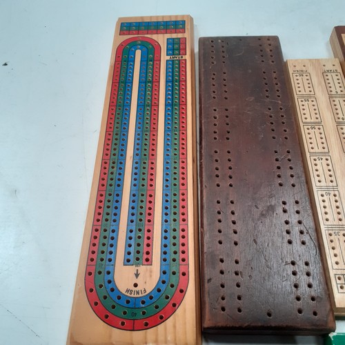 9 - 5 very  attractive cribbage boards with a sixth small cased one and 3 decks of playing cards. Some g... 