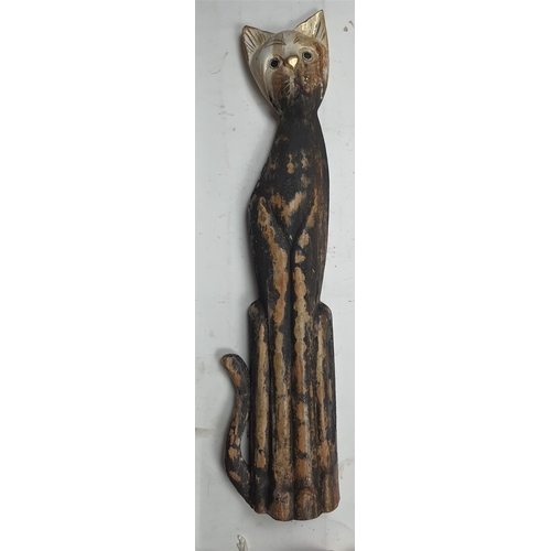 132A - A large freestanding wood painted cat. Size: 70 cm x 17 cm x 7 cm.