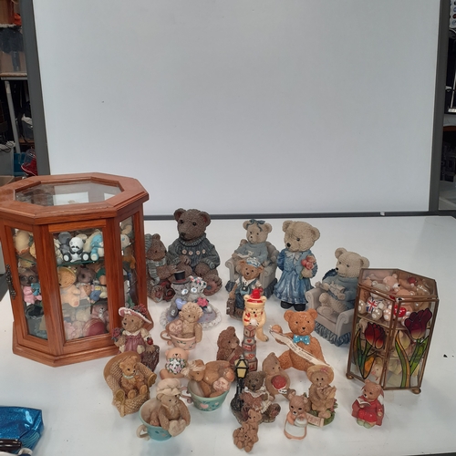 17 - Large quantity of small ceramic amd pottery bear ornaments.  Loads inside two smal glazed display ca... 