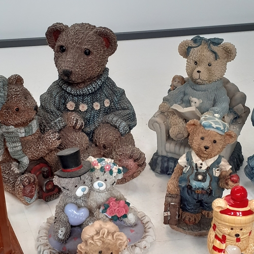 17 - Large quantity of small ceramic amd pottery bear ornaments.  Loads inside two smal glazed display ca... 