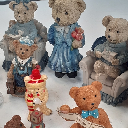 17 - Large quantity of small ceramic amd pottery bear ornaments.  Loads inside two smal glazed display ca... 