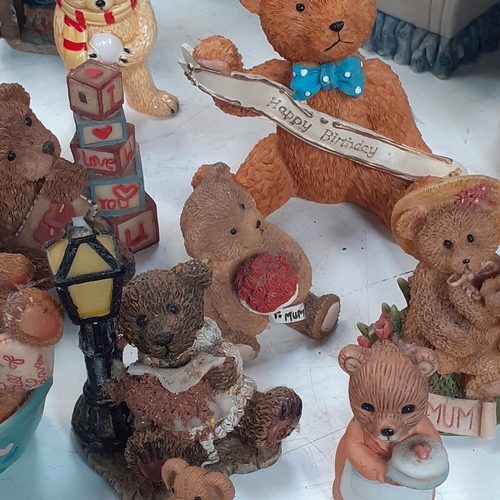 17 - Large quantity of small ceramic amd pottery bear ornaments.  Loads inside two smal glazed display ca... 