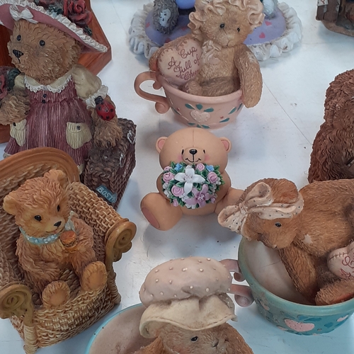 17 - Large quantity of small ceramic amd pottery bear ornaments.  Loads inside two smal glazed display ca... 