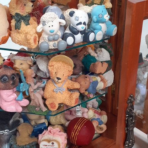 17 - Large quantity of small ceramic amd pottery bear ornaments.  Loads inside two smal glazed display ca... 