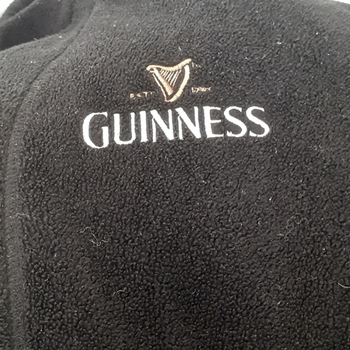 22 - A Guiness clothing bundle. Includes his and hers dressing gowns and 5 t-shirts. Sizes are larger siz... 