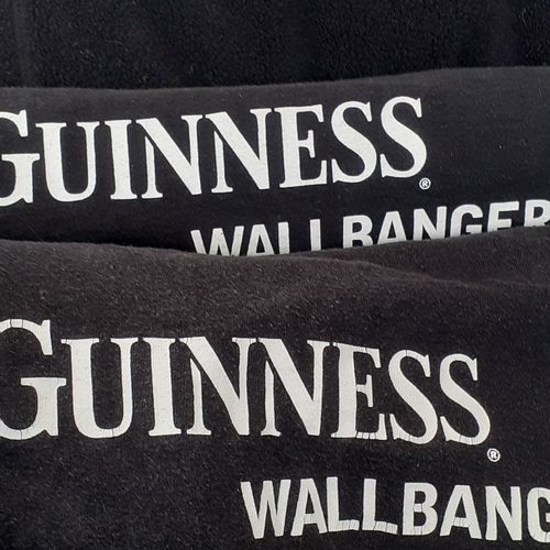 22 - A Guiness clothing bundle. Includes his and hers dressing gowns and 5 t-shirts. Sizes are larger siz... 