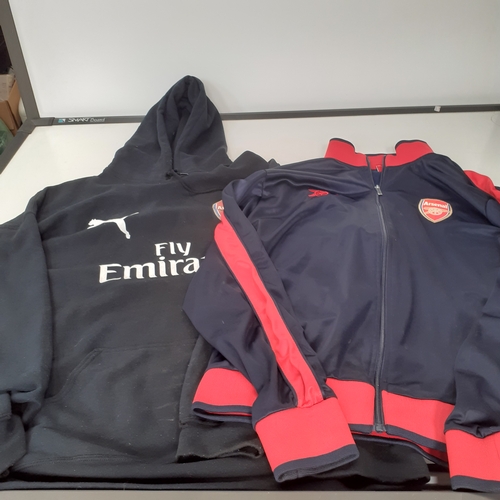 24 - 2 Arsenal tops. One hoodie and one tracksuit top. Havr been worn condition and would benefit from a ... 