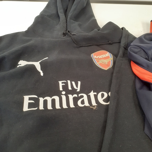 24 - 2 Arsenal tops. One hoodie and one tracksuit top. Havr been worn condition and would benefit from a ... 