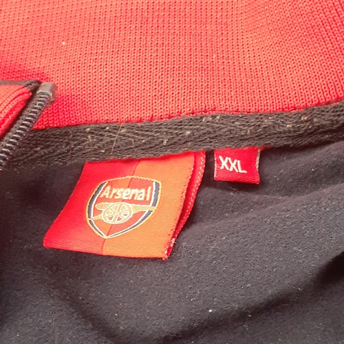 24 - 2 Arsenal tops. One hoodie and one tracksuit top. Havr been worn condition and would benefit from a ... 