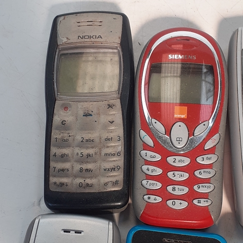 28 - Selection of 8 old style mobile phones.  Mostly Nokia with one or two other models.