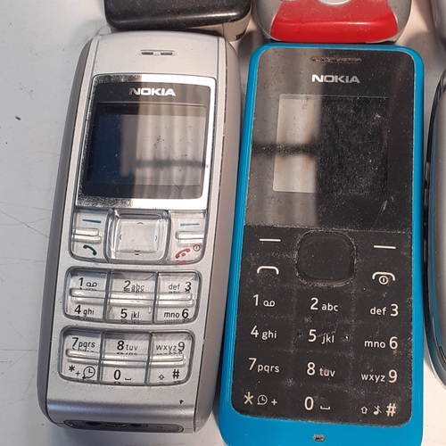 28 - Selection of 8 old style mobile phones.  Mostly Nokia with one or two other models.