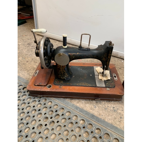 281 - Vintage sewing machine in case