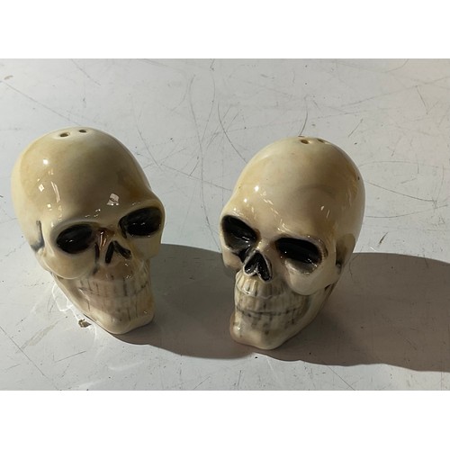 66 - Pair of skulls cruet set