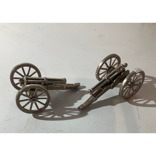 112 - 2 x silver coloured metal canons