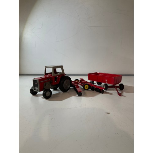 132 - Large die cast tractor, plough and trailer by ERTL made in the USA