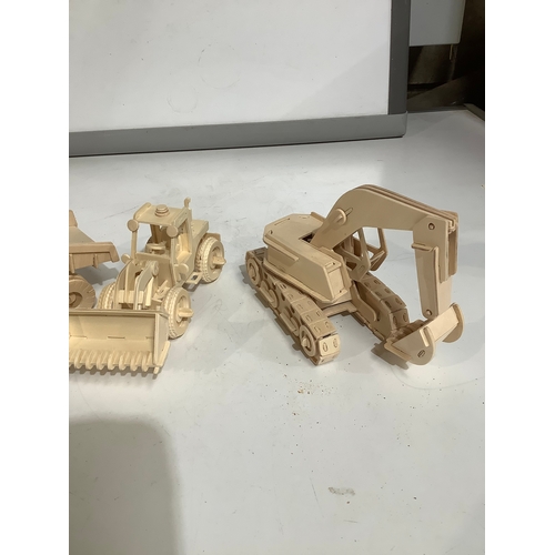 295 - Wooden models includes dumper truck digger tractor plus Caterpillar digger