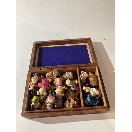 471 - Decorative wooden box filled with piggy ornaments