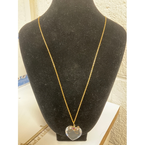 180A - 14kt gold filled necklace long chain weighing 2g with glass crystal style heart with bow and centre ... 