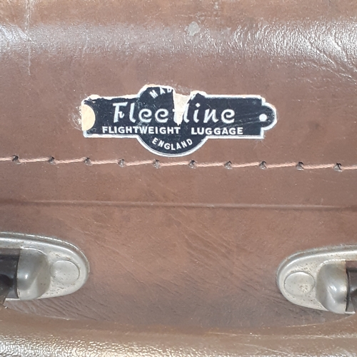 21 - Vintage Fleetline hard shell suitcase. Overall good used condition. No keys but open