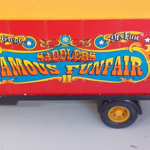 1 - Saddlers Famous Funfair diecast truck and trailer by Corgi caravan.