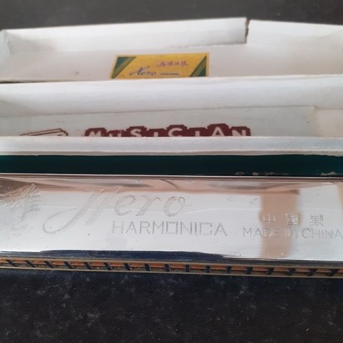 7 - Hero harmonica in original box. Harmonica is good but box a bit worn