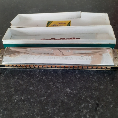 7 - Hero harmonica in original box. Harmonica is good but box a bit worn