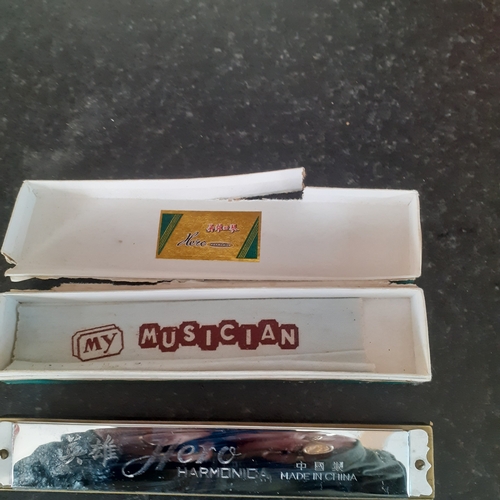 7 - Hero harmonica in original box. Harmonica is good but box a bit worn