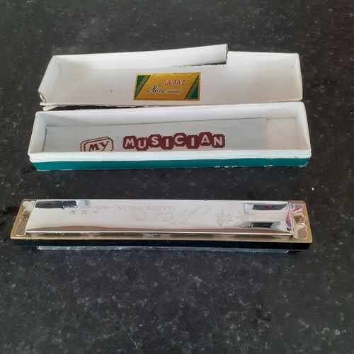 7 - Hero harmonica in original box. Harmonica is good but box a bit worn