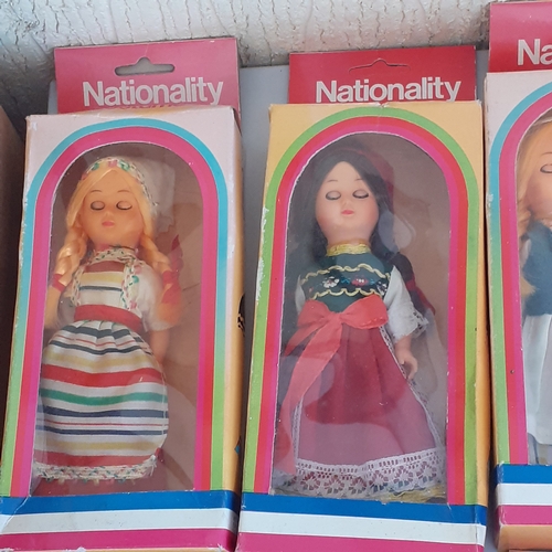 8 - Quantity of full set of 12 nationality costume dolls with sleeping eyes. Dolls never been out of box... 